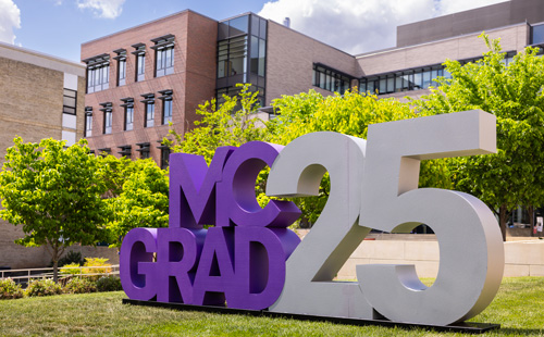 MC Grad 25 purple and white monument on the Rockville campus in front of the Student Services building