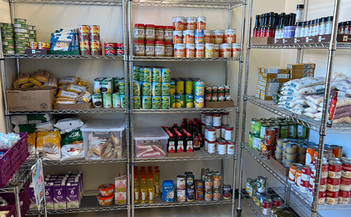 Items in the Takoma Park/Silver Spring Campus food pantry on wire shelving