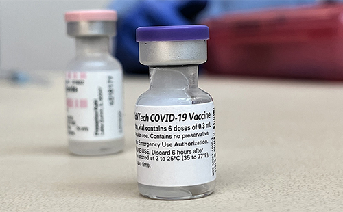 vaccine vials sitting on the table