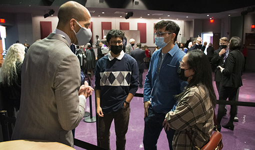 Dr. Jermaine Williams talking with students