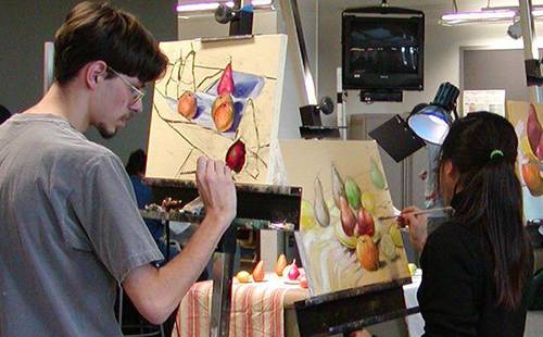 MC arts students working at easels