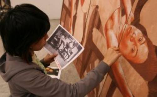 MC student painting using photograph model