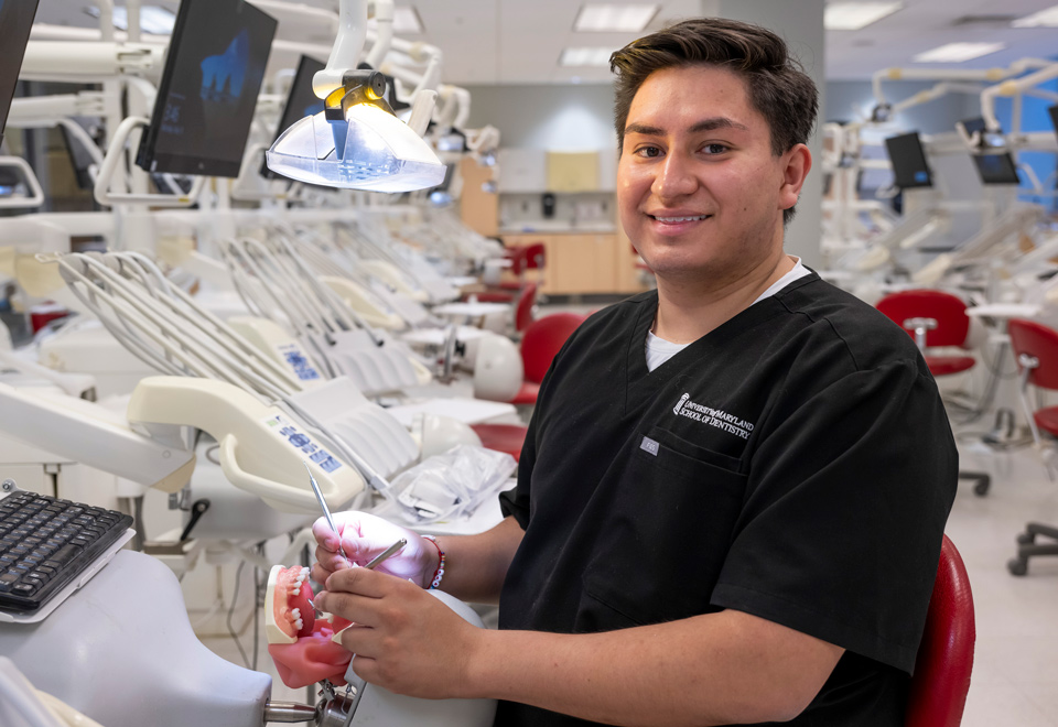 Jorge Torres sitting in the dentistry lab
