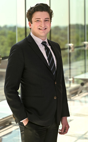 Michael Adcock standing in the office